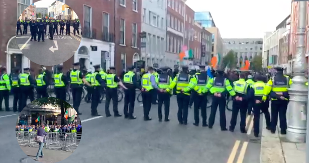 远离这个区域：爱尔兰警方和数千名反口罩抗议者在议会外对峙