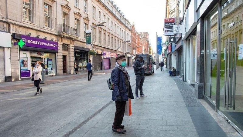 People wearing a face masks on Henry St in Dublin